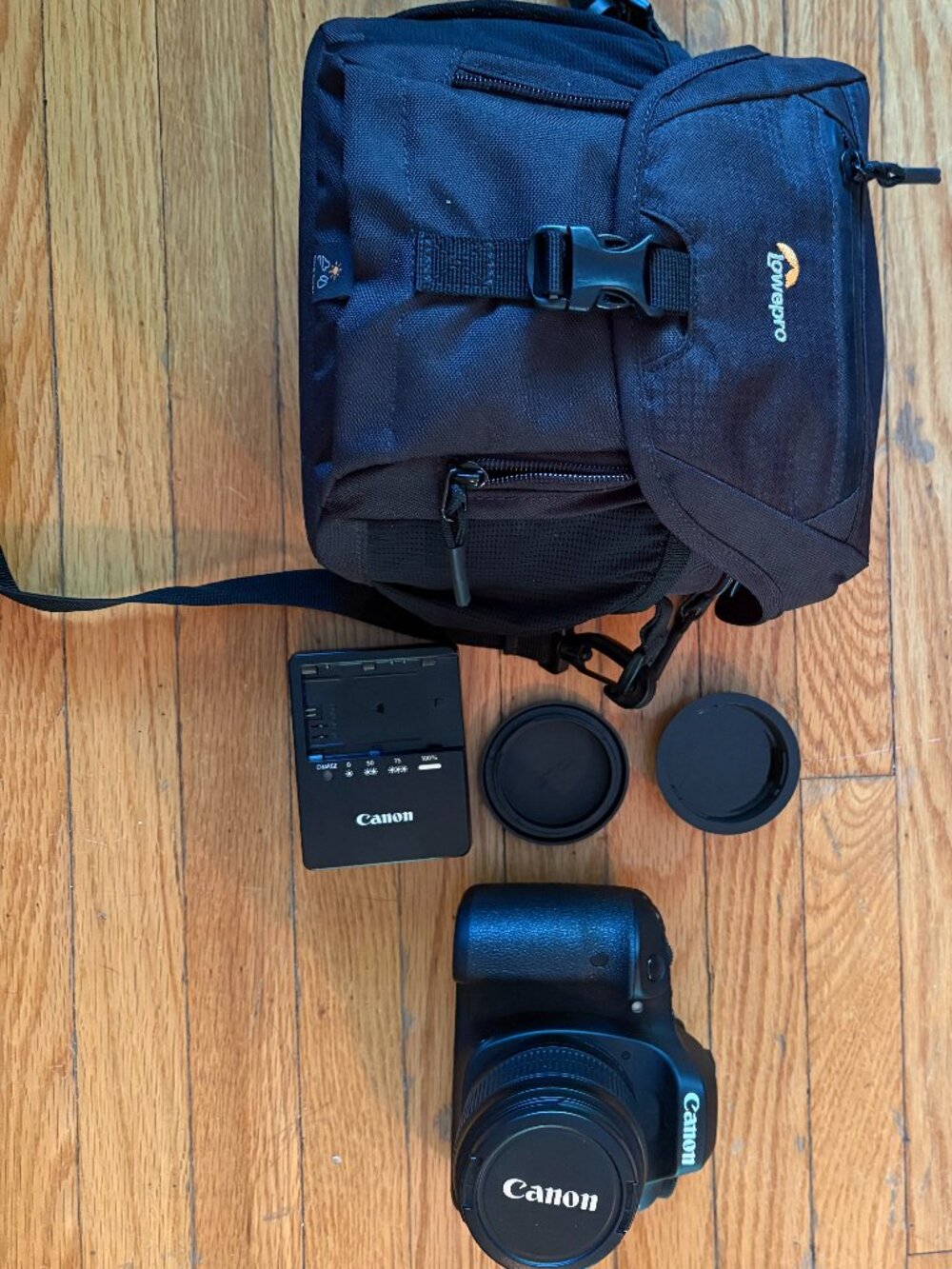 Canon EOS digital SLR (DSLR) camera with a standard zoom lens & camera bag